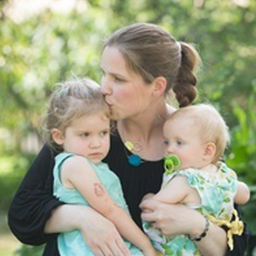 photo of Dr. Kealy Mann, ND holding her two children