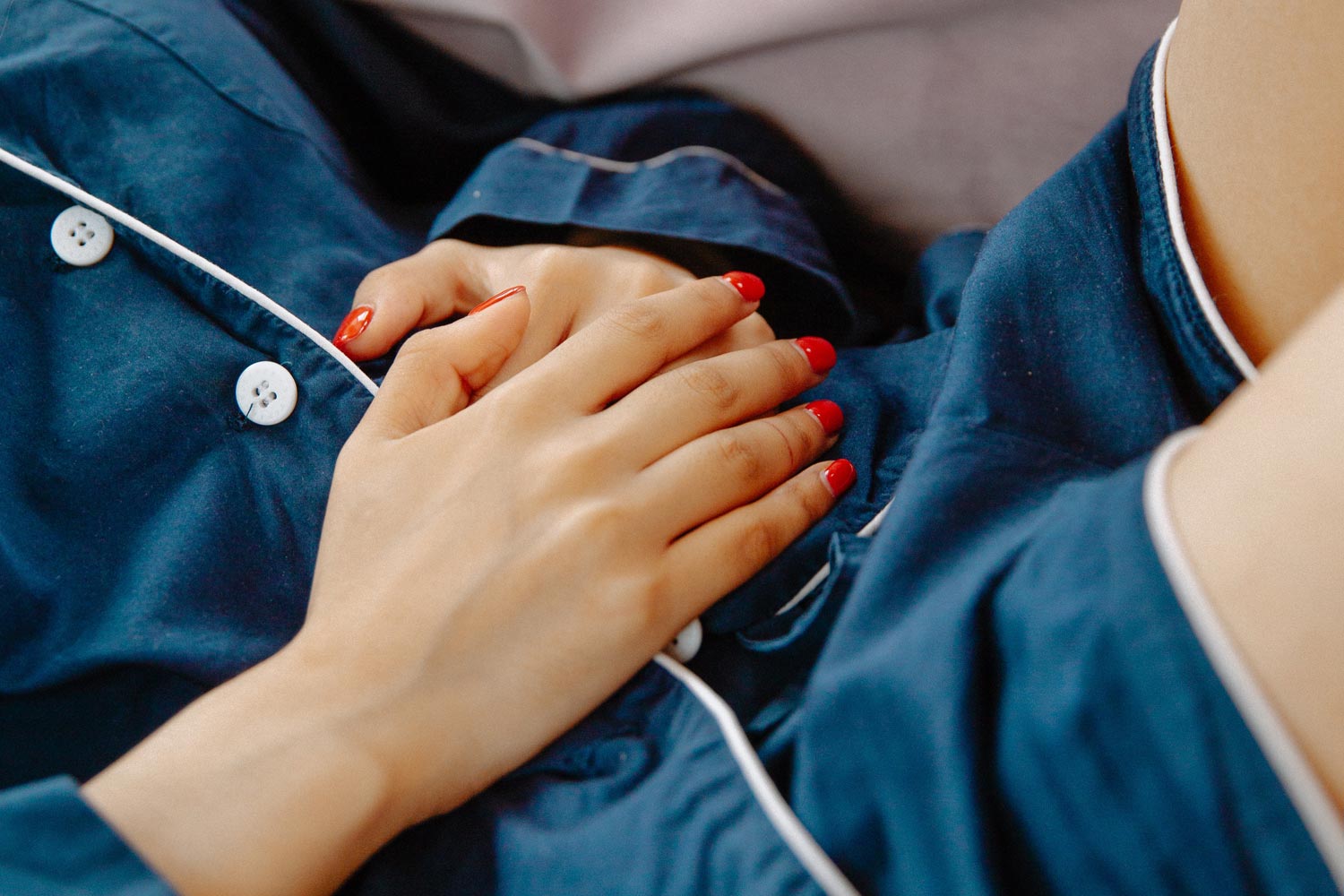 woman holding stomach ache